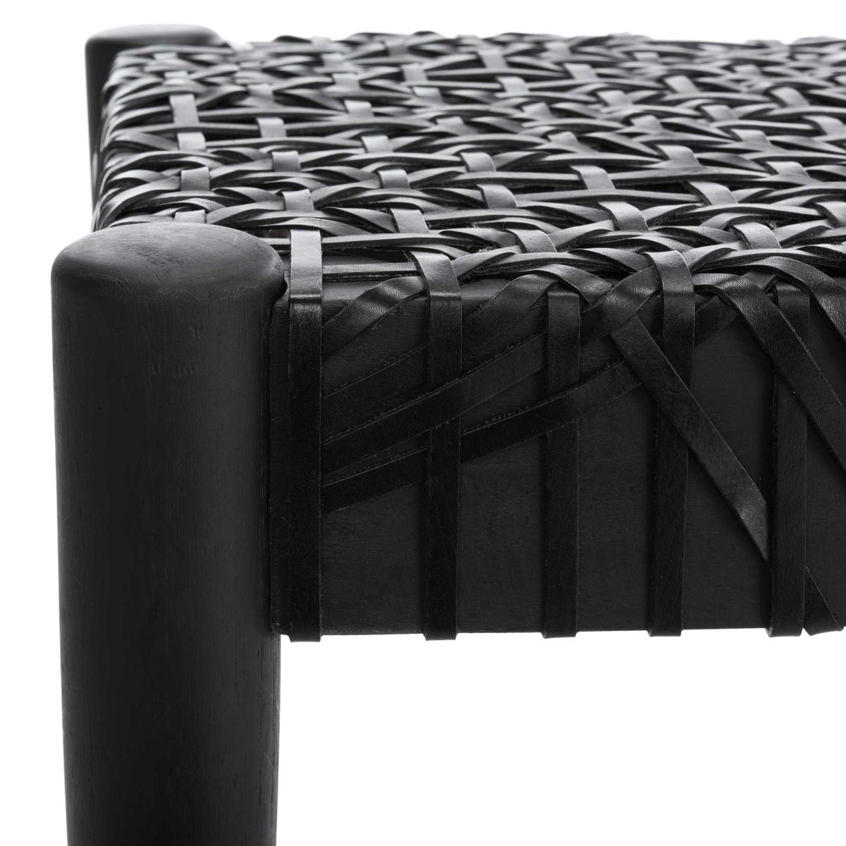 Black leather bands overlap and wrap the seat frame beside a rounded wood post.