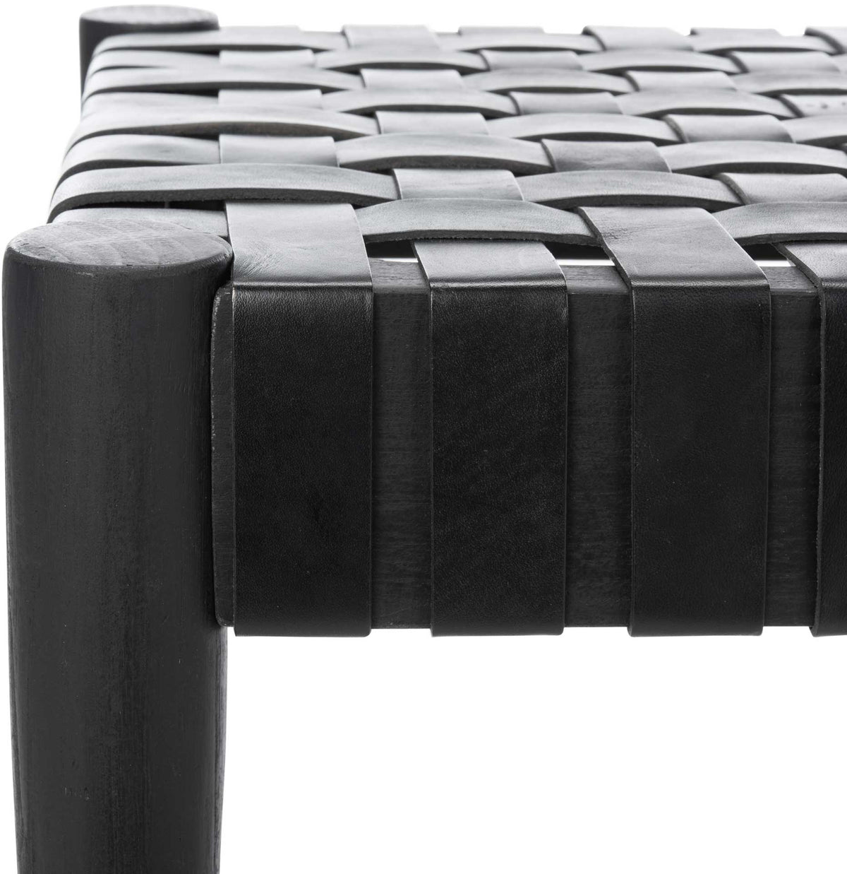 Broad black leather straps cross over the seat and wrap around its wood rail.