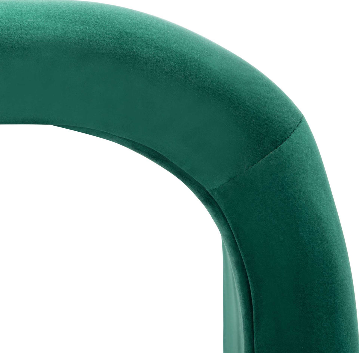 A tailored seam follows the rounded corner of the rich emerald velvet.