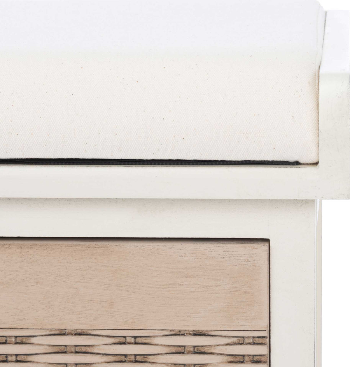 A softly cushioned white seat sits above a distressed white rail and a natural basket front.