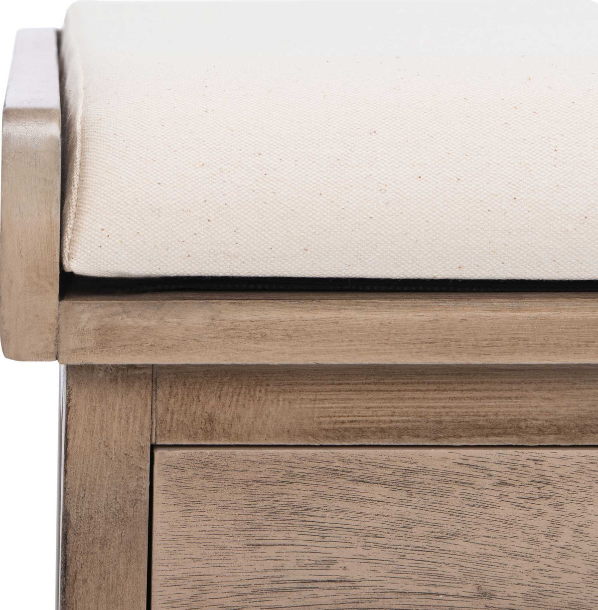 White cotton upholstery sits snug against the sand-toned wood rail of the bench.