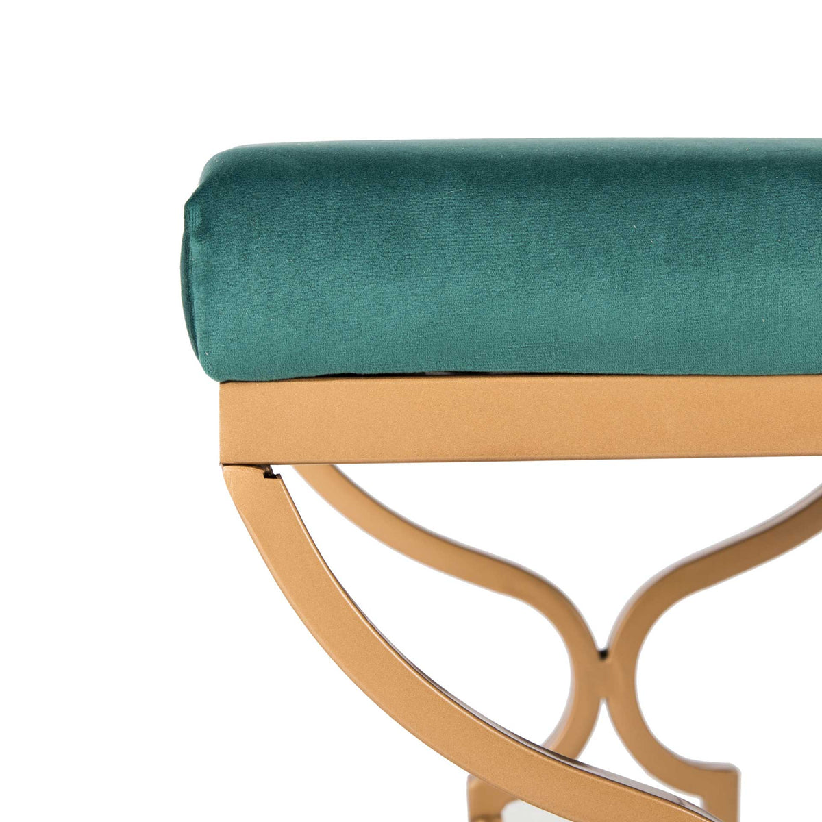 Soft velvet upholstery meets a gold frame and decorative curved metalwork