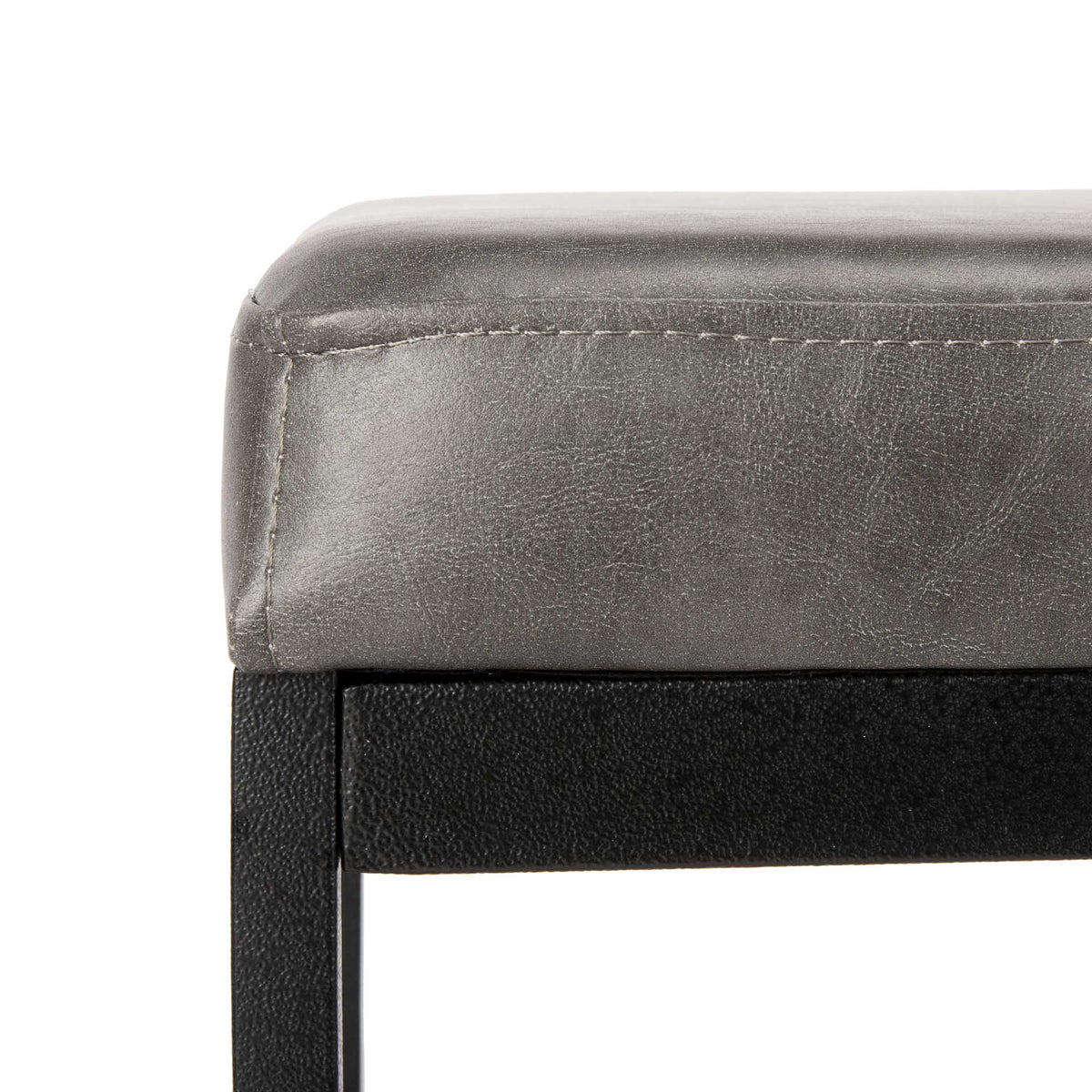 Fine stitching edges the textured gray faux leather seat above a black metal frame