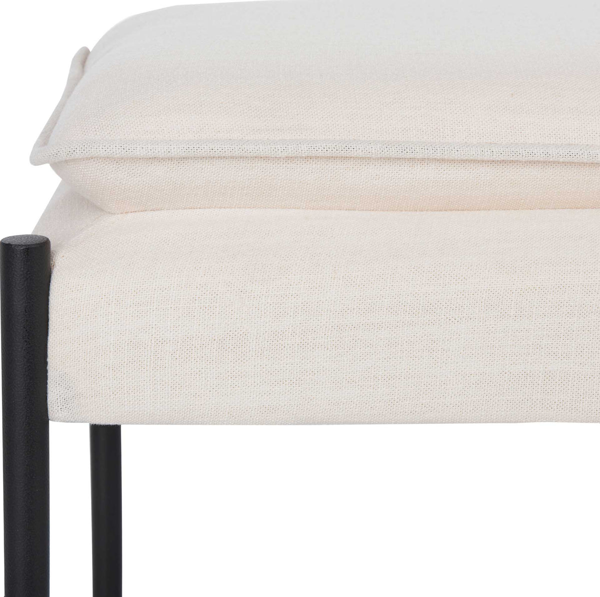 Light beige woven linen cushion has a soft raised edge and tailored piping