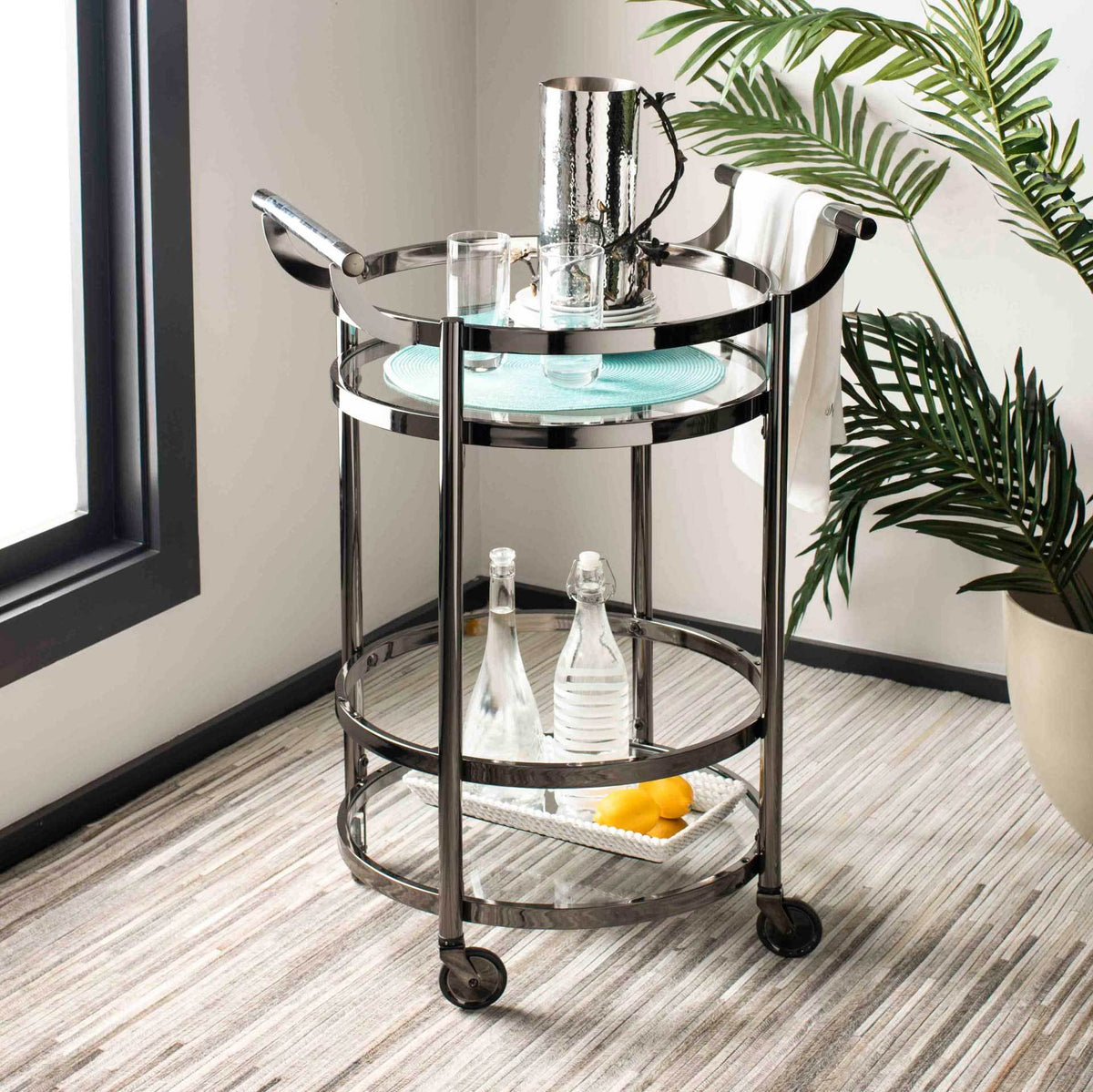 Black nickel and glass create a refined rolling station for drinks and barware