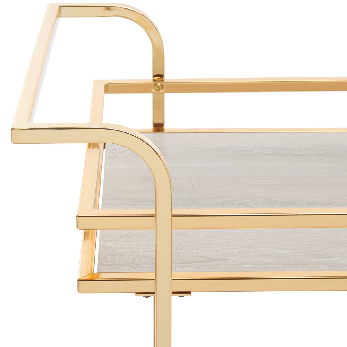 Gleaming gold handles arch above the gray upper shelf and protective metal rails.