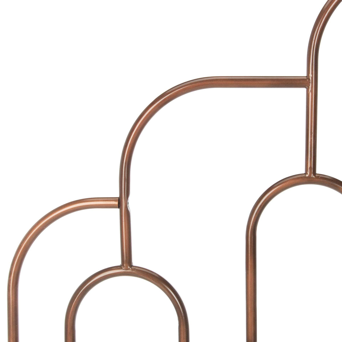 Antique bronze metalwork forms stepped arches and graceful oval accents