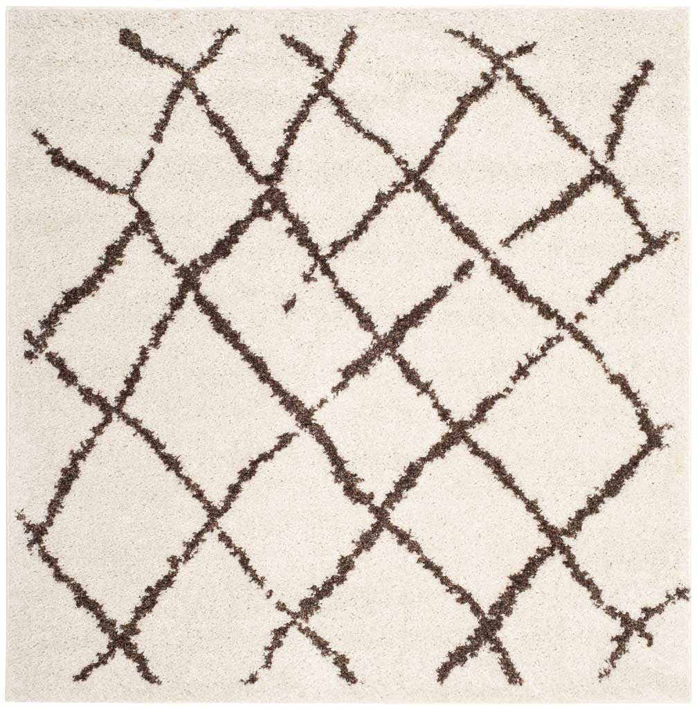 Square cream shag rug with bold brown lattice lines and a plush texture