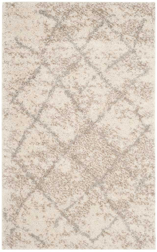 Compact cream shag rug with softly blurred gray diamonds and a cozy pile
