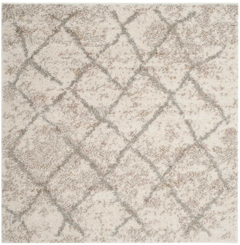 Square cream shag rug with subtle gray lattice lines and warm, speckled texture