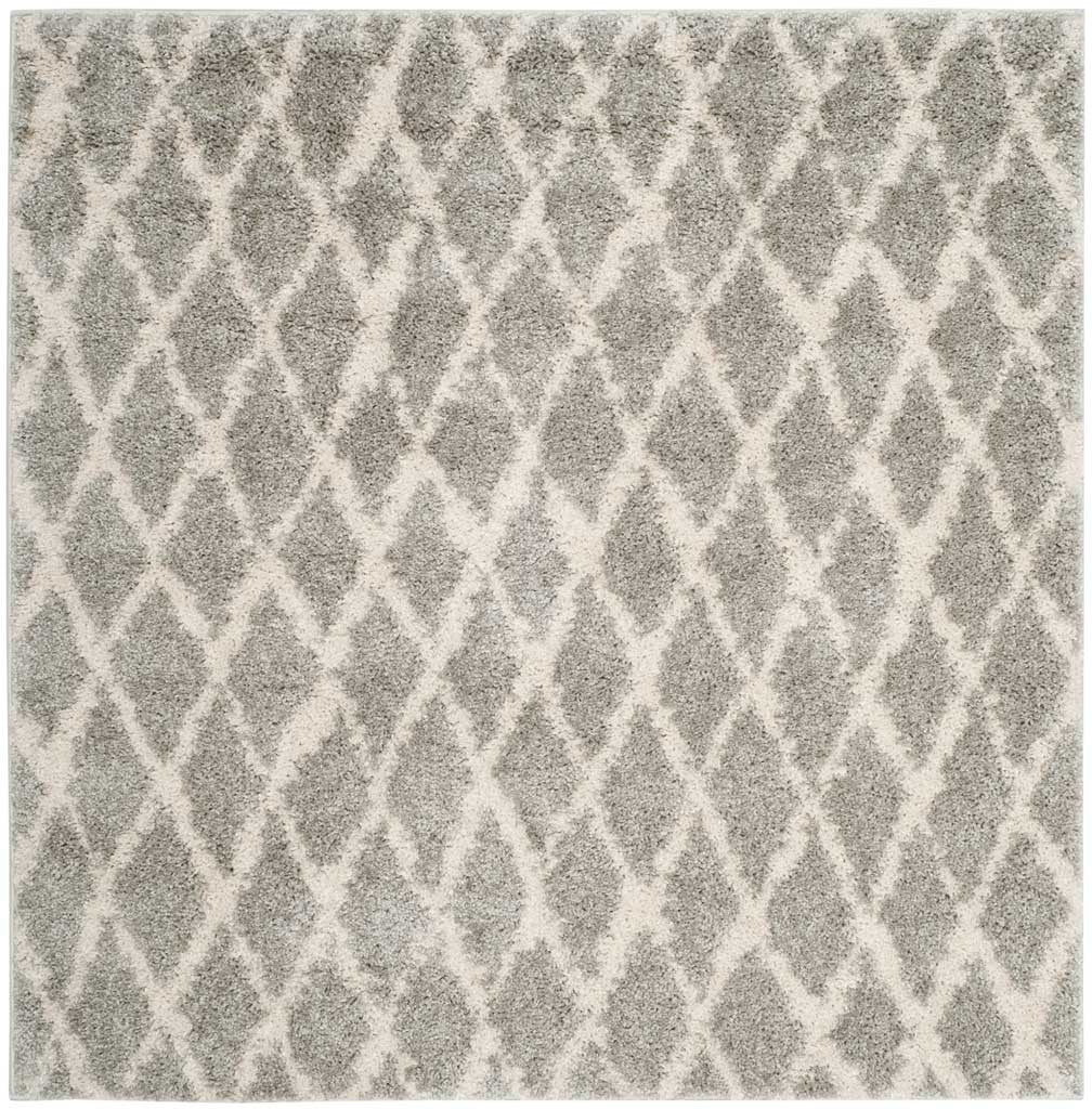 Square shag rug combines plush gray pile with a cream diamond lattice.