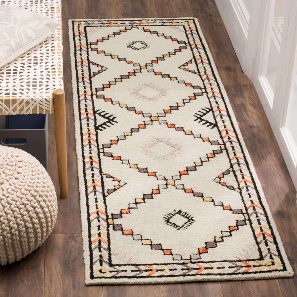 Hand-tufted runner adds warmth with geometric motifs and an intricately patterned border