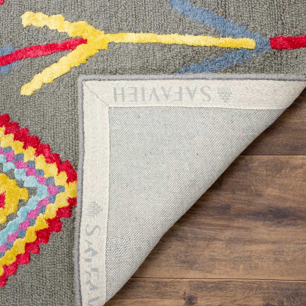 A folded corner reveals the woven backing and neatly bound edge beneath the tufted wool surface.