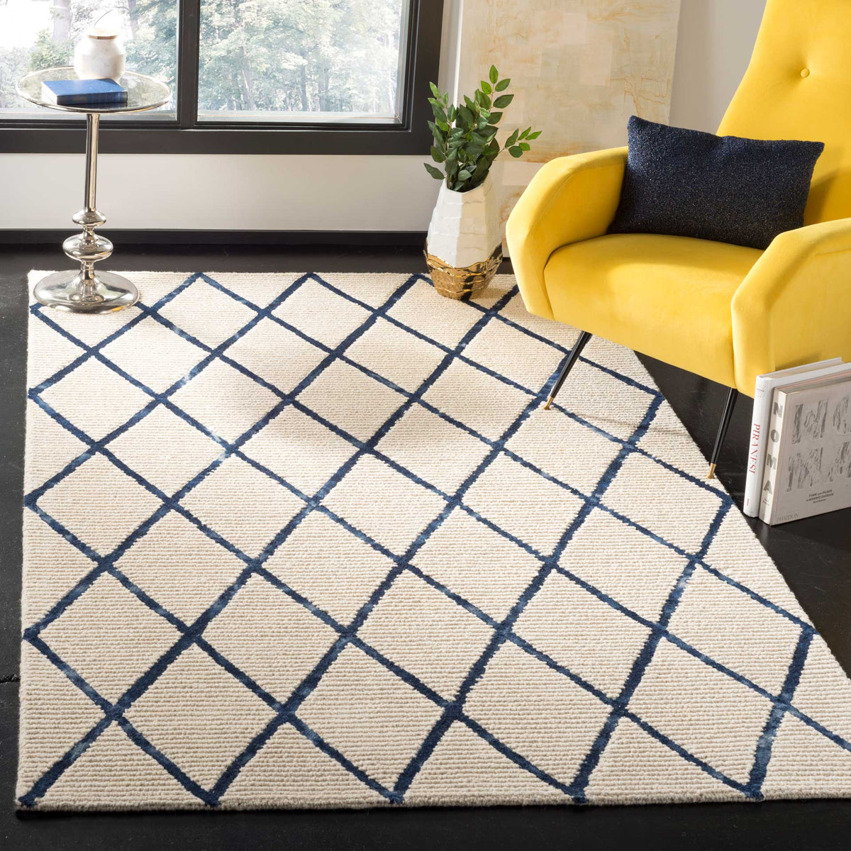 An ivory wool rug with bold navy diamonds creates a lively foundation for colorful furnishings.