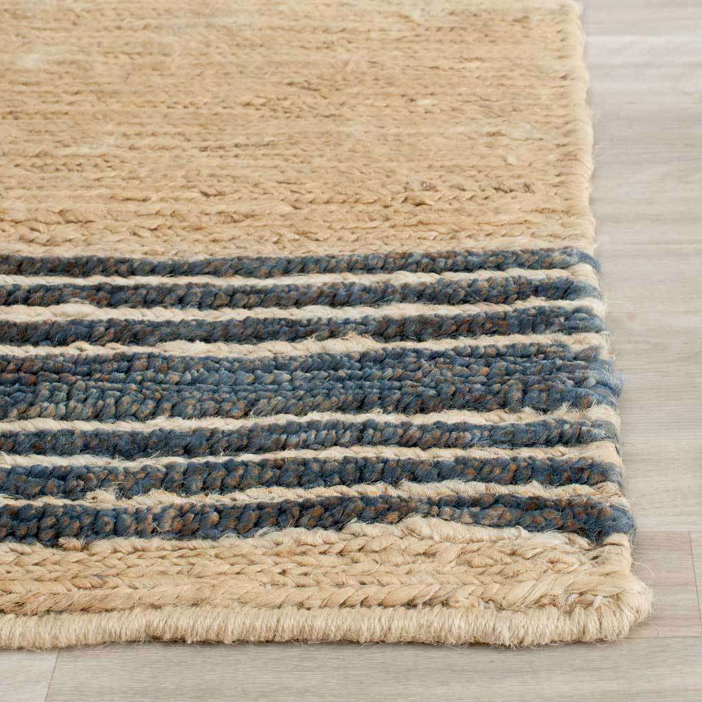 Varied blue bands highlight a chunky jute weave and a softly bound edge