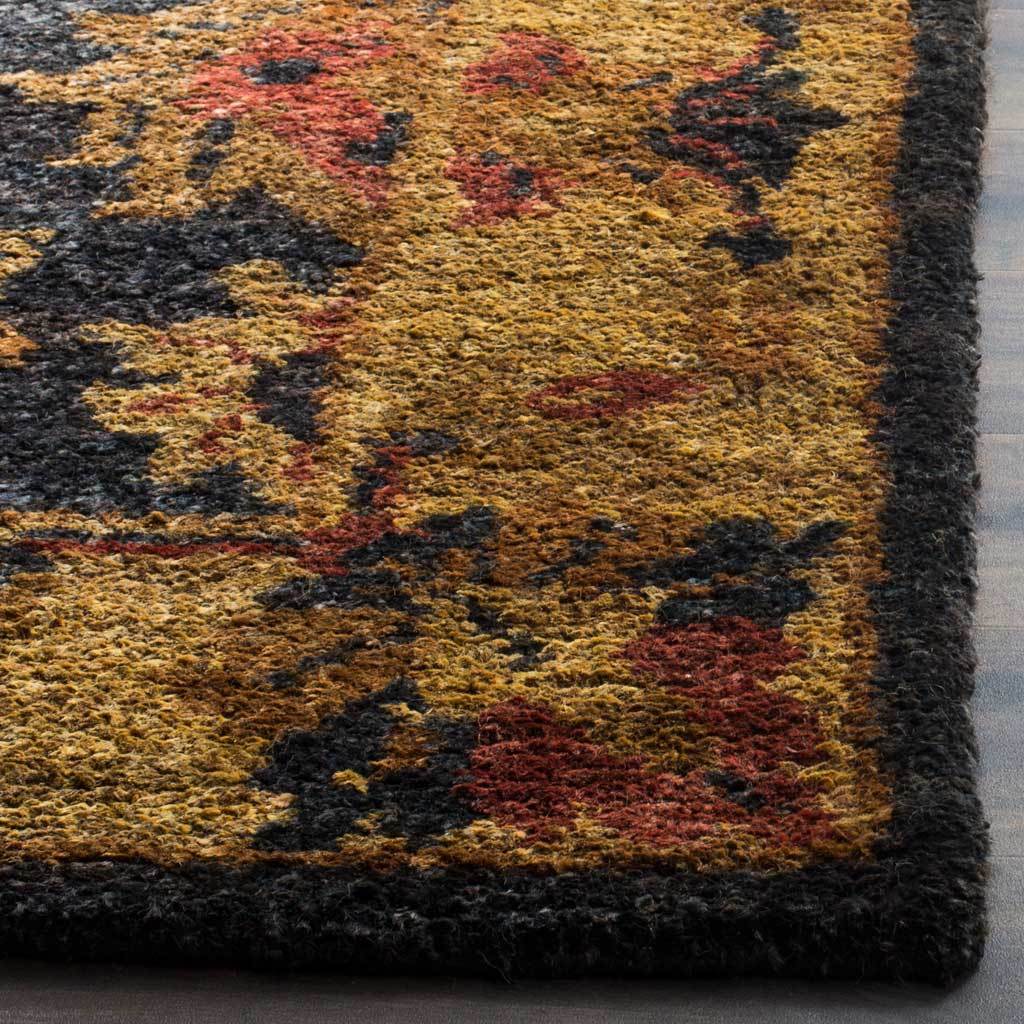 Dense, hand-tufted hemp pile blends gold, rust and charcoal floral details along a dark edge