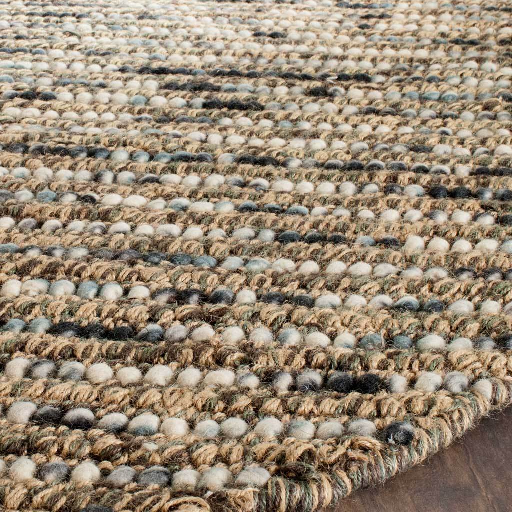 Blue and cream loops mingle with natural jute at the rug's finished edge