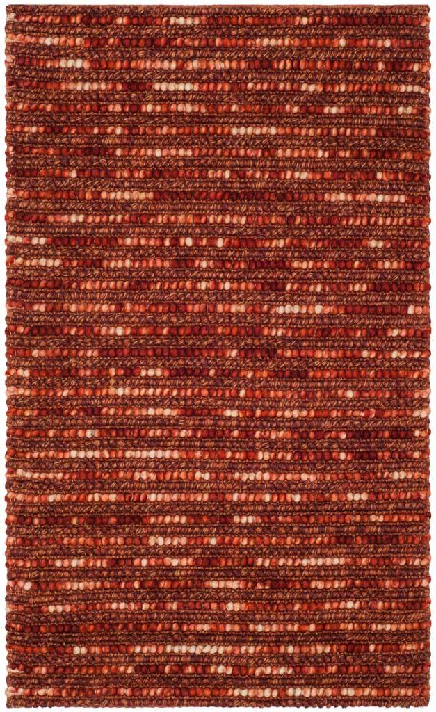 Earthy red and orange tones mingle in raised rows across this handwoven rug