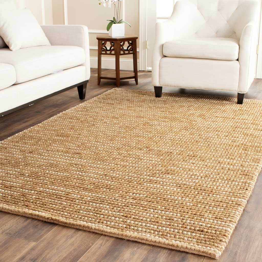 Neatly edged beige rug adds woven texture and subtle stripes to a bright living space