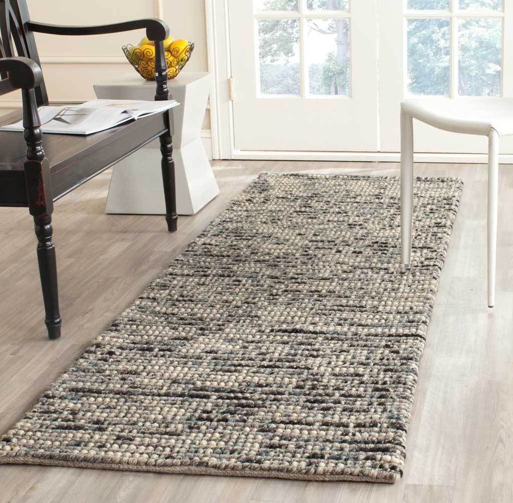 A gray runner lends natural texture and softly speckled contrast to the floor