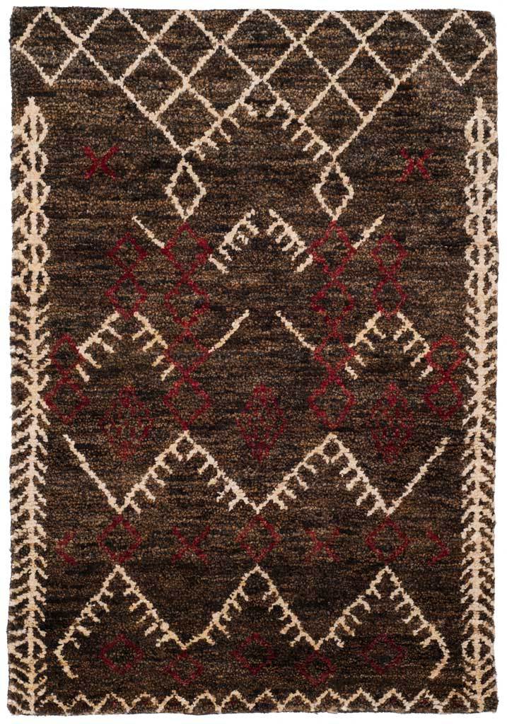 Dark brown rug with bold ivory zigzags, diamond motifs and deep red accents