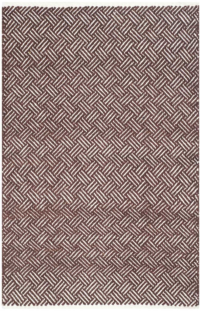 An accent-size brown and ivory rug adds a rhythmic herringbone motif in flat-woven cotton.