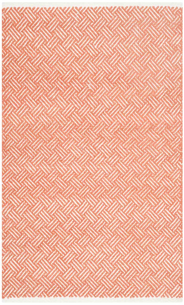 This orange and ivory accent rug layers interlocking woven lines across a cotton surface.