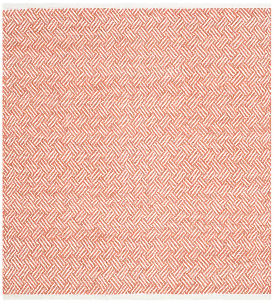 A square orange and ivory rug features densely woven chevrons for bright, graphic appeal.