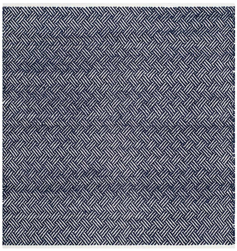 A square navy and ivory cotton rug showcases crisp, interlocking herringbone lines.