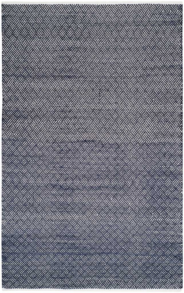 A 5' x 8' cotton rug pairs deep navy with ivory in a fine, repeating geometric weave.