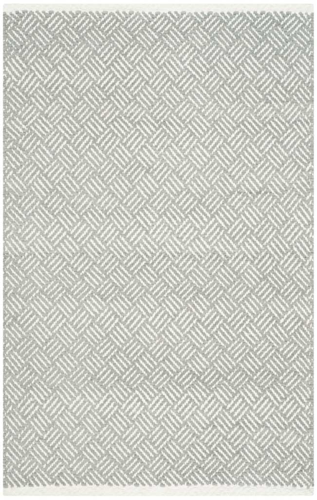 A petite gray and ivory accent rug layers a delicate chevron weave over a light neutral palette.