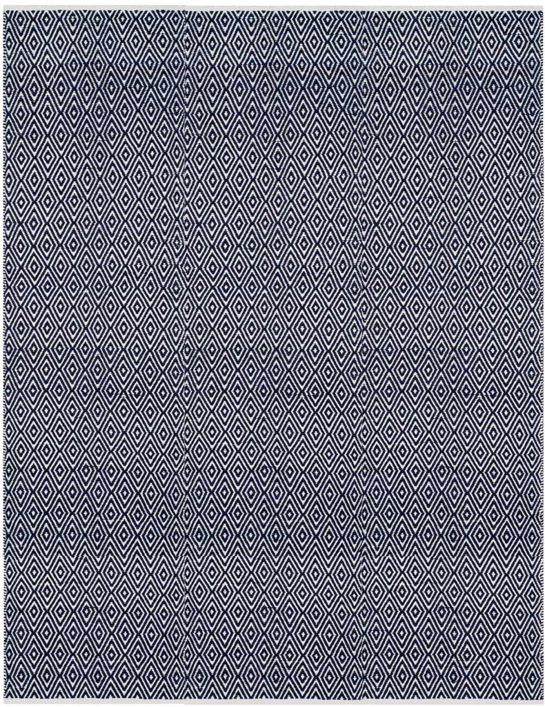 Bold navy contrasts with ivory in a repeating diamond motif.