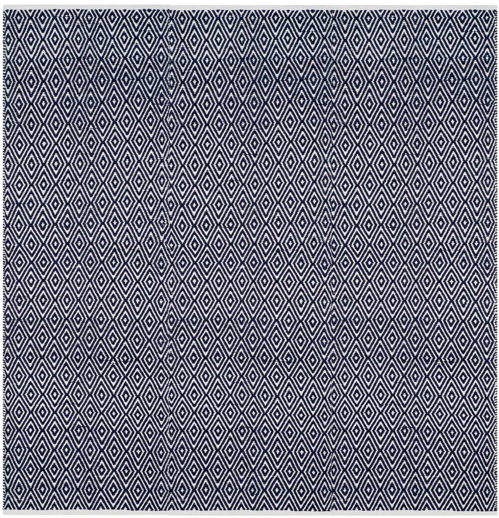 Tightly spaced ivory diamonds cover this square navy rug.