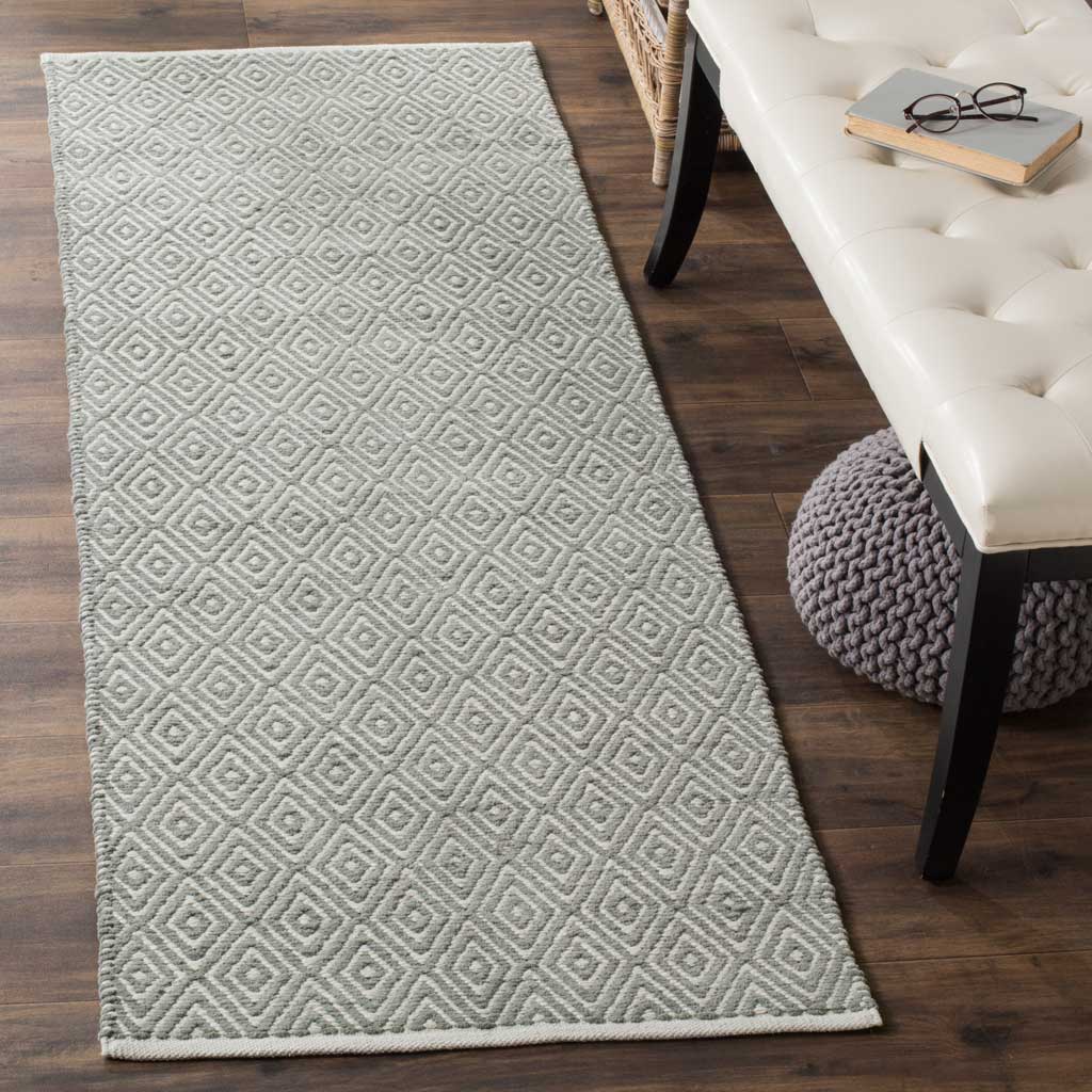 Soft gray and white diamonds lend subtle texture to this flat-woven cotton runner