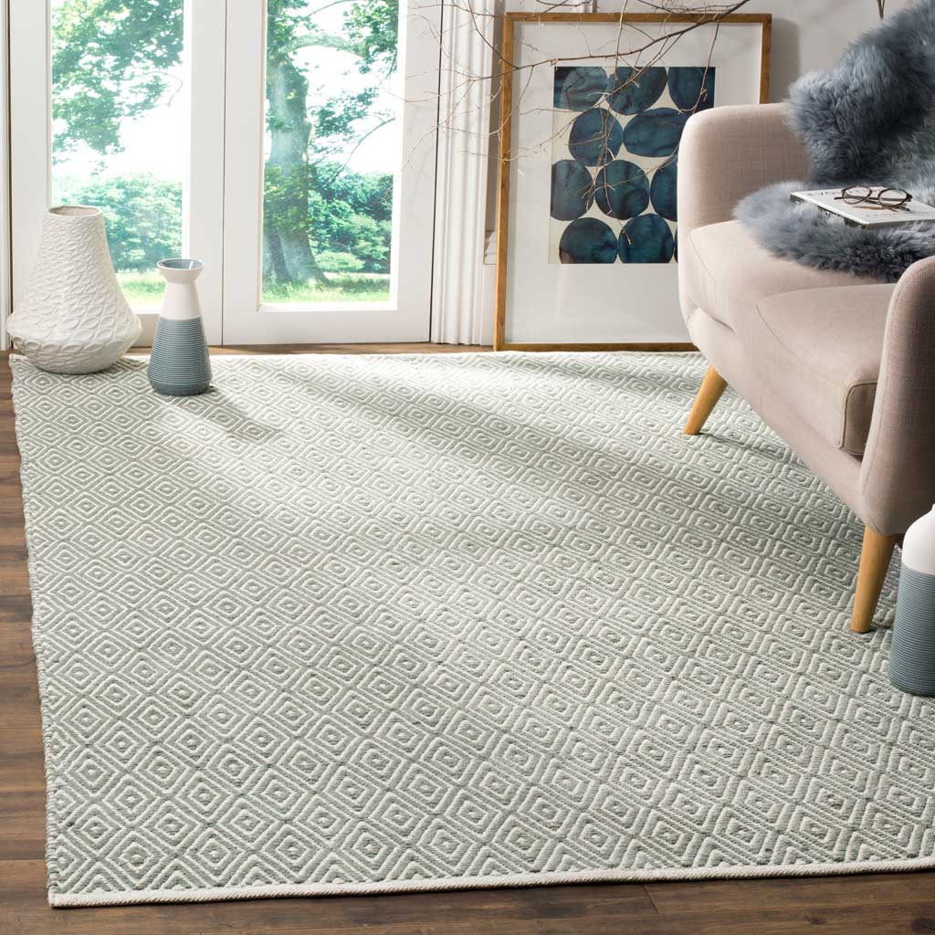 Delicate gray diamonds add warmth and texture beneath living room furnishings.