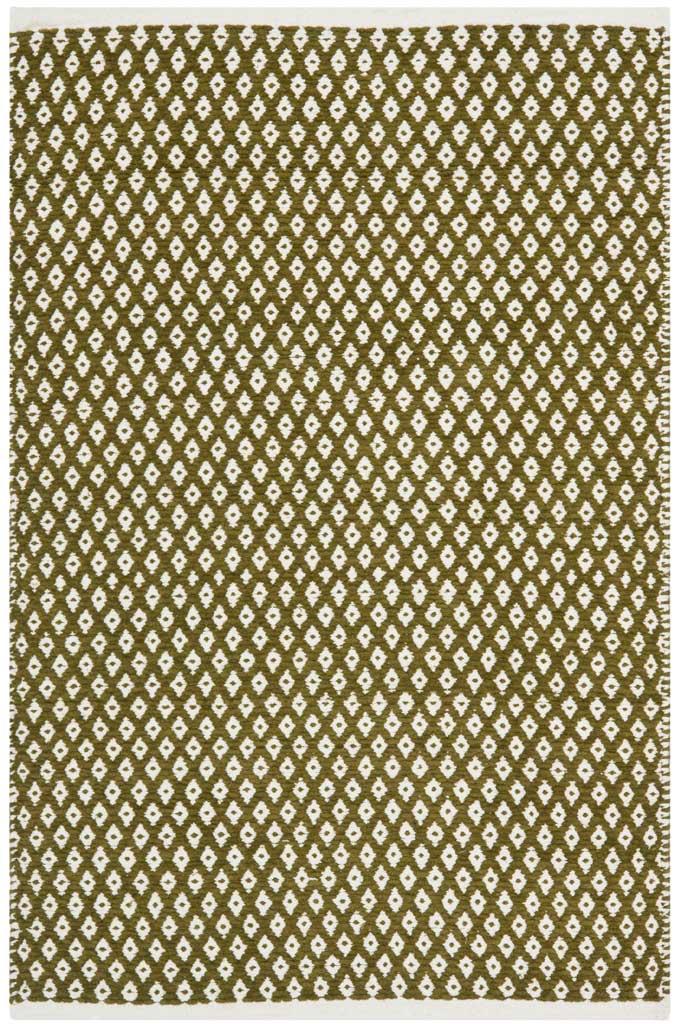 This rectangular olive rug features dense ivory diamonds and a flat-woven texture.