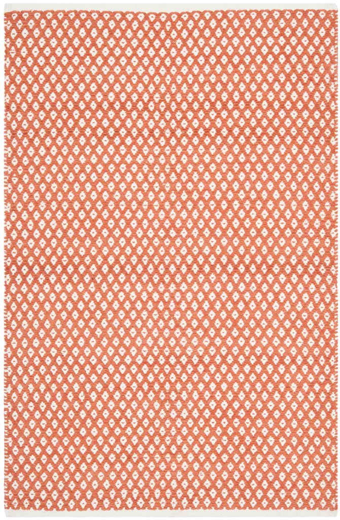 This rectangular orange cotton rug is brightened by tightly spaced ivory geometric diamonds.