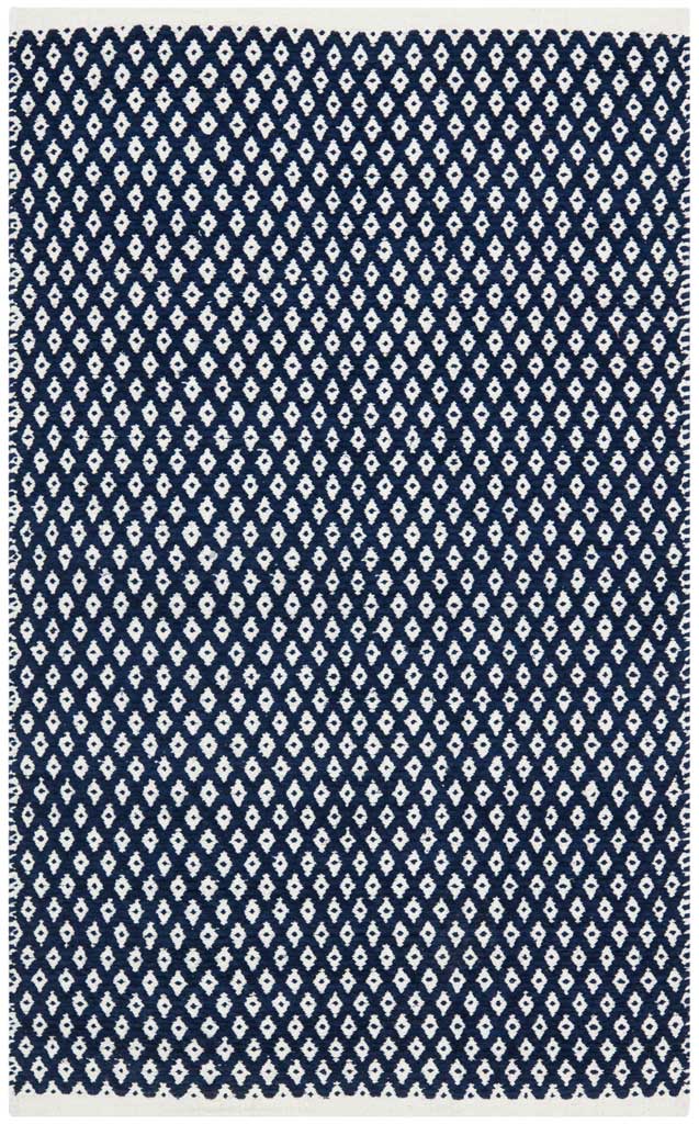 A compact navy accent rug offers allover white geometric diamonds in a flat-woven design.