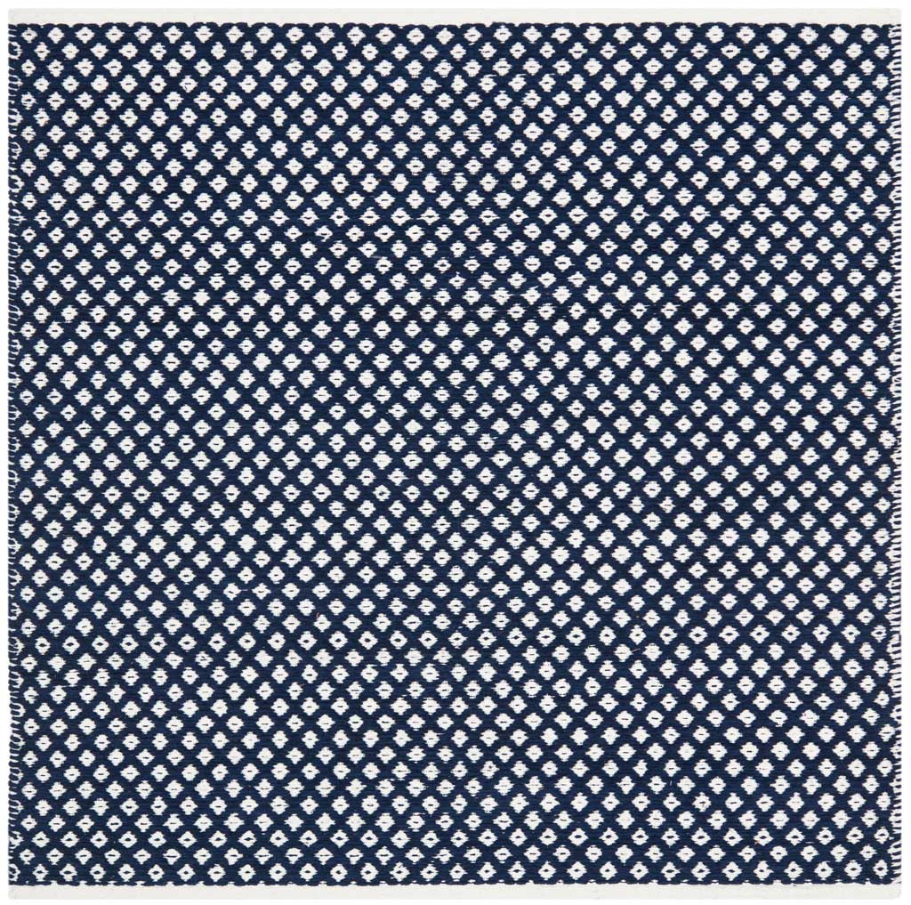 This square navy rug blends a rhythmic white diamond pattern with a clean, light edge.
