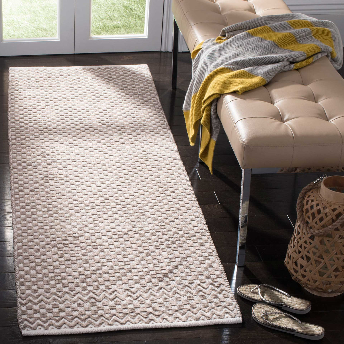 Neutral taupe runner brings subtle texture with small-scale checks and zigzag end accents