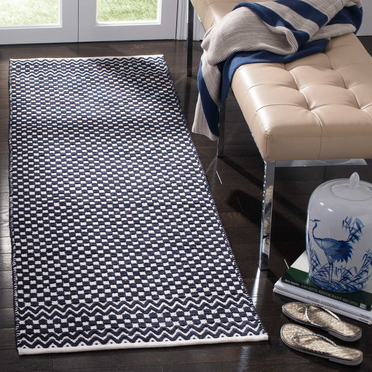 Deep navy runner adds contrast with textured ivory checks and wavy accents at each end
