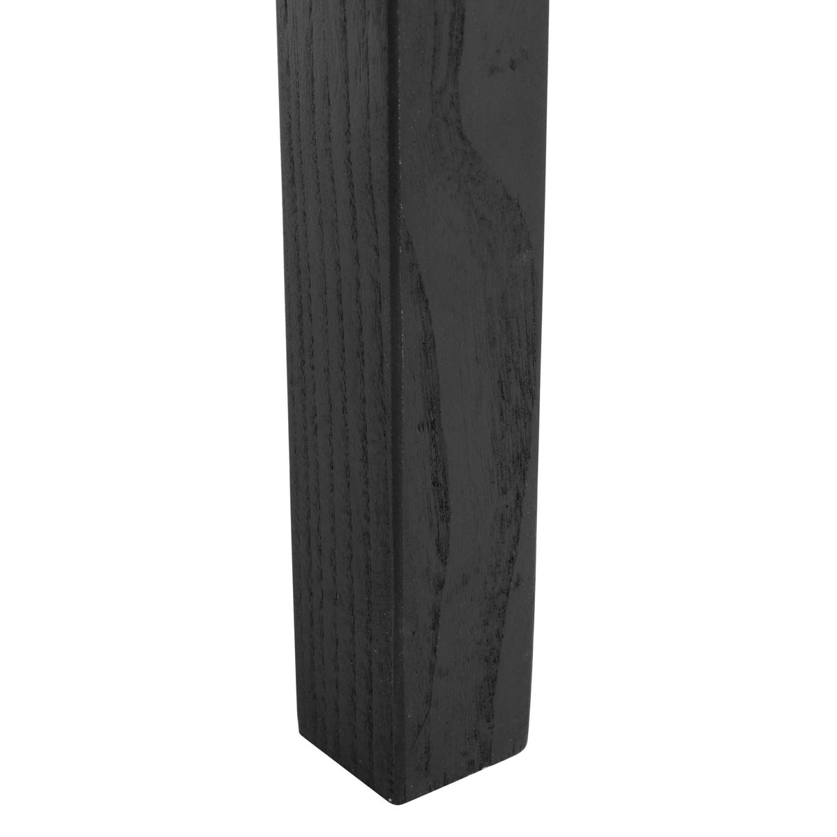 A subtly tapered black wood leg reveals natural grain beneath its sleek finish.