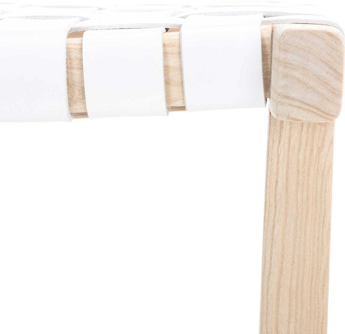 White leather straps loop around the wood seat rail beside a softly grained leg