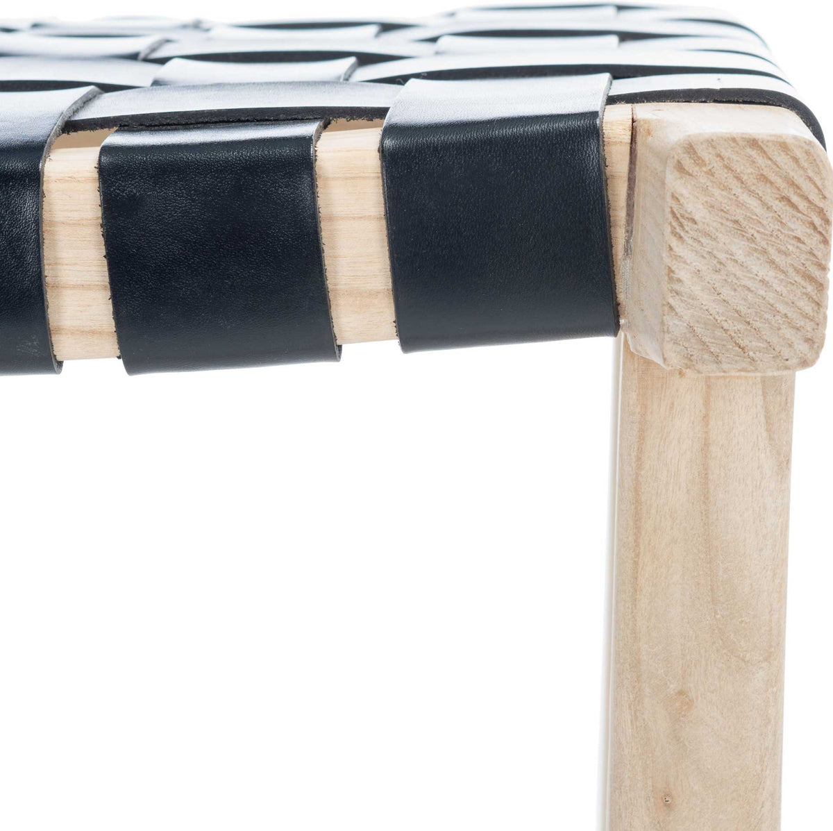 Smooth black leather straps wrap around the pale wood seat frame, revealing the woven construction