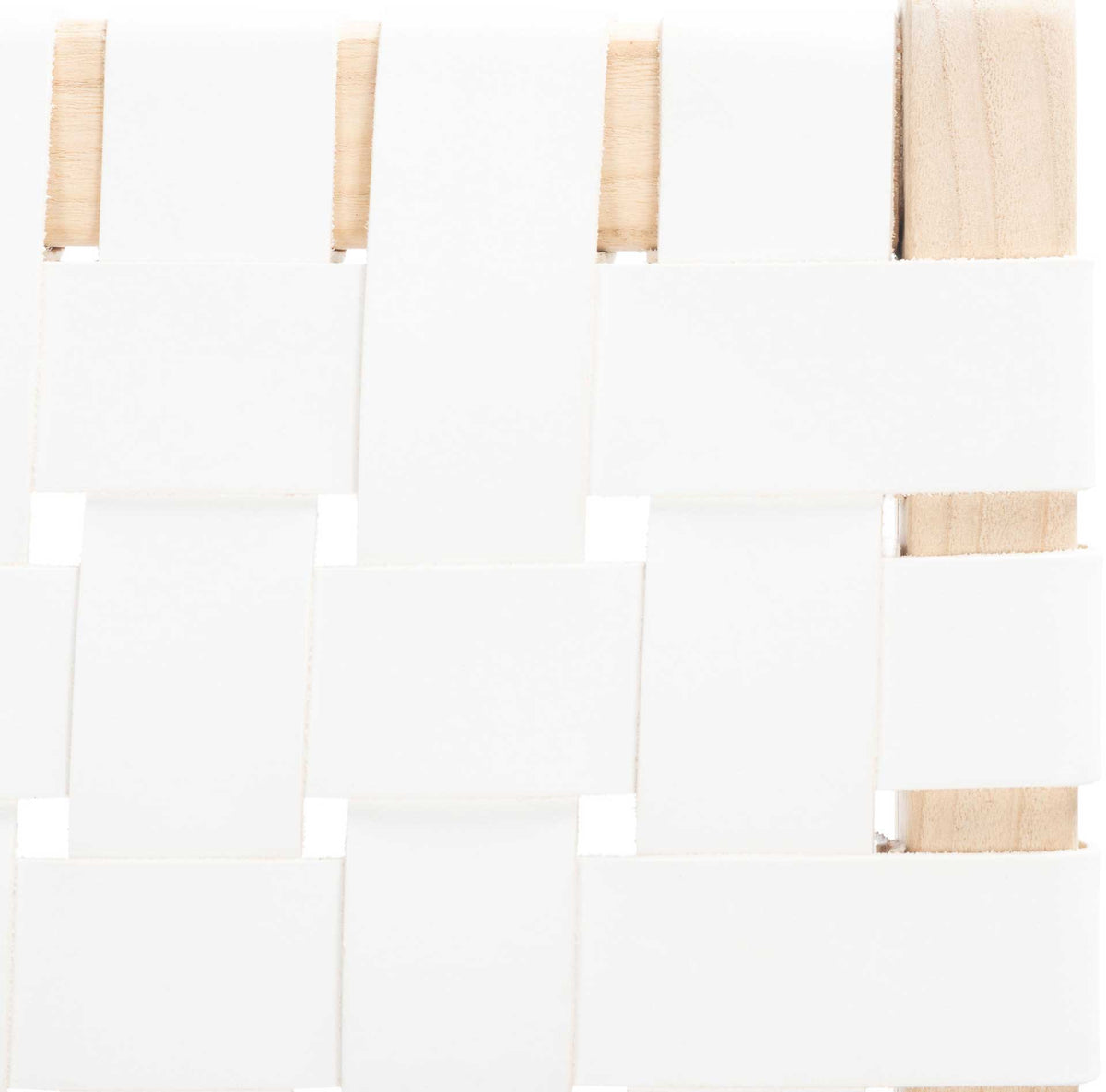 Wide white leather straps cross neatly over pale wood, adding crisp geometric texture.
