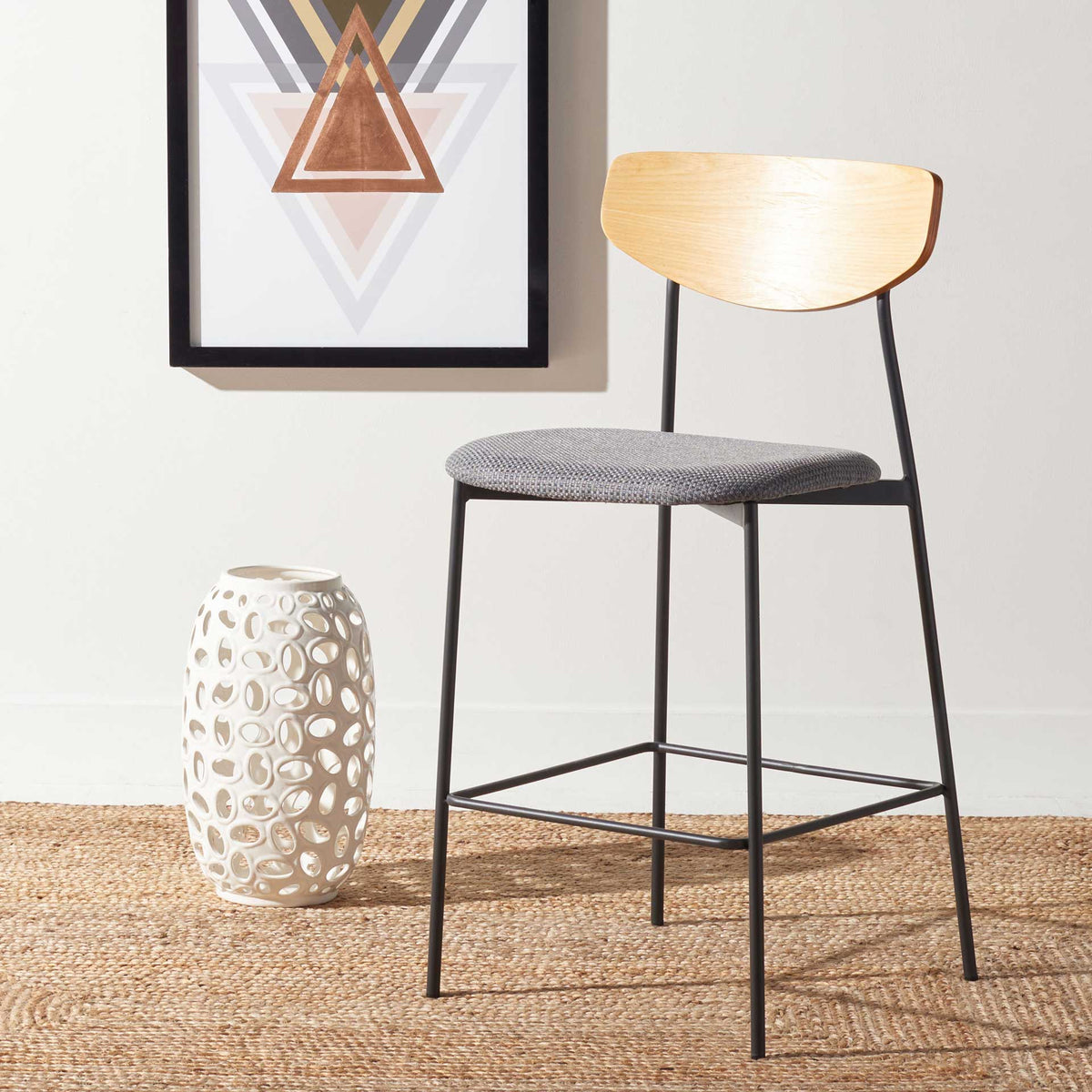 Oak and gray counter stool combines a curved wooden back with a cushioned seat and lean iron legs