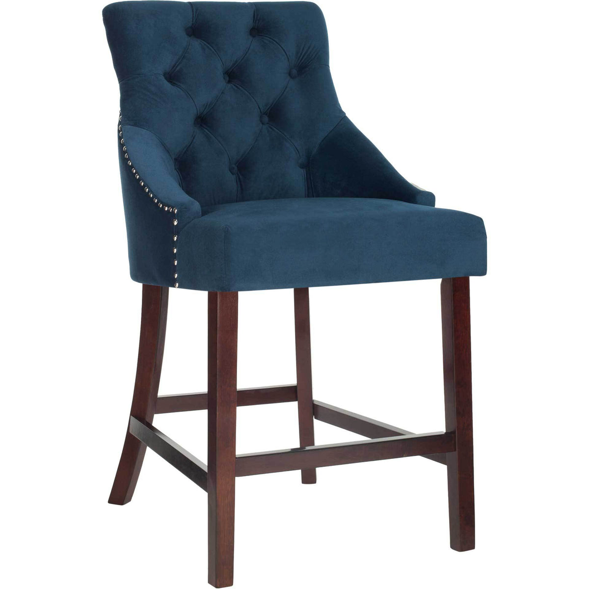 Navy velvet counter stool pairs a button-tufted wingback with chrome nailheads and espresso wood legs.