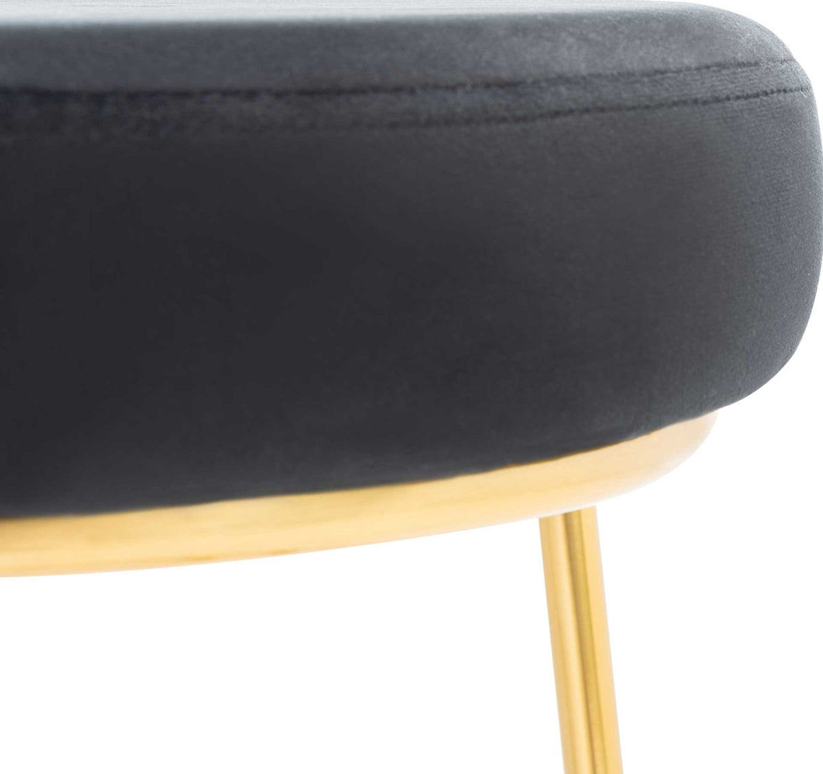 Black velvet upholstery meets a slim gold seat rim with a tailored seam