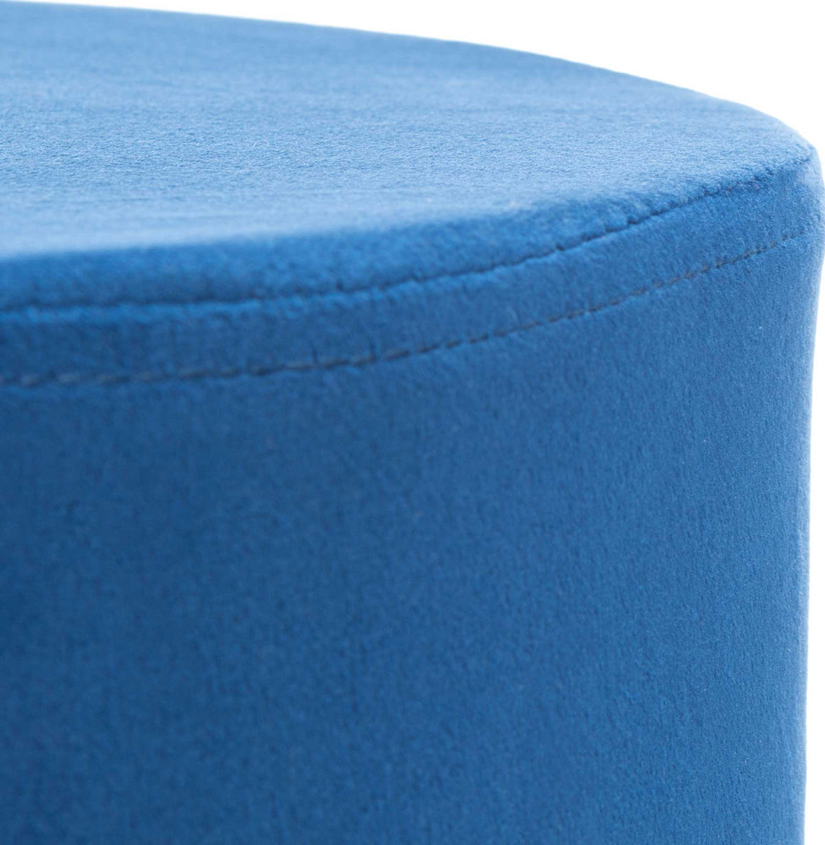A neat seam traces the curve of the soft navy blue velvet seat