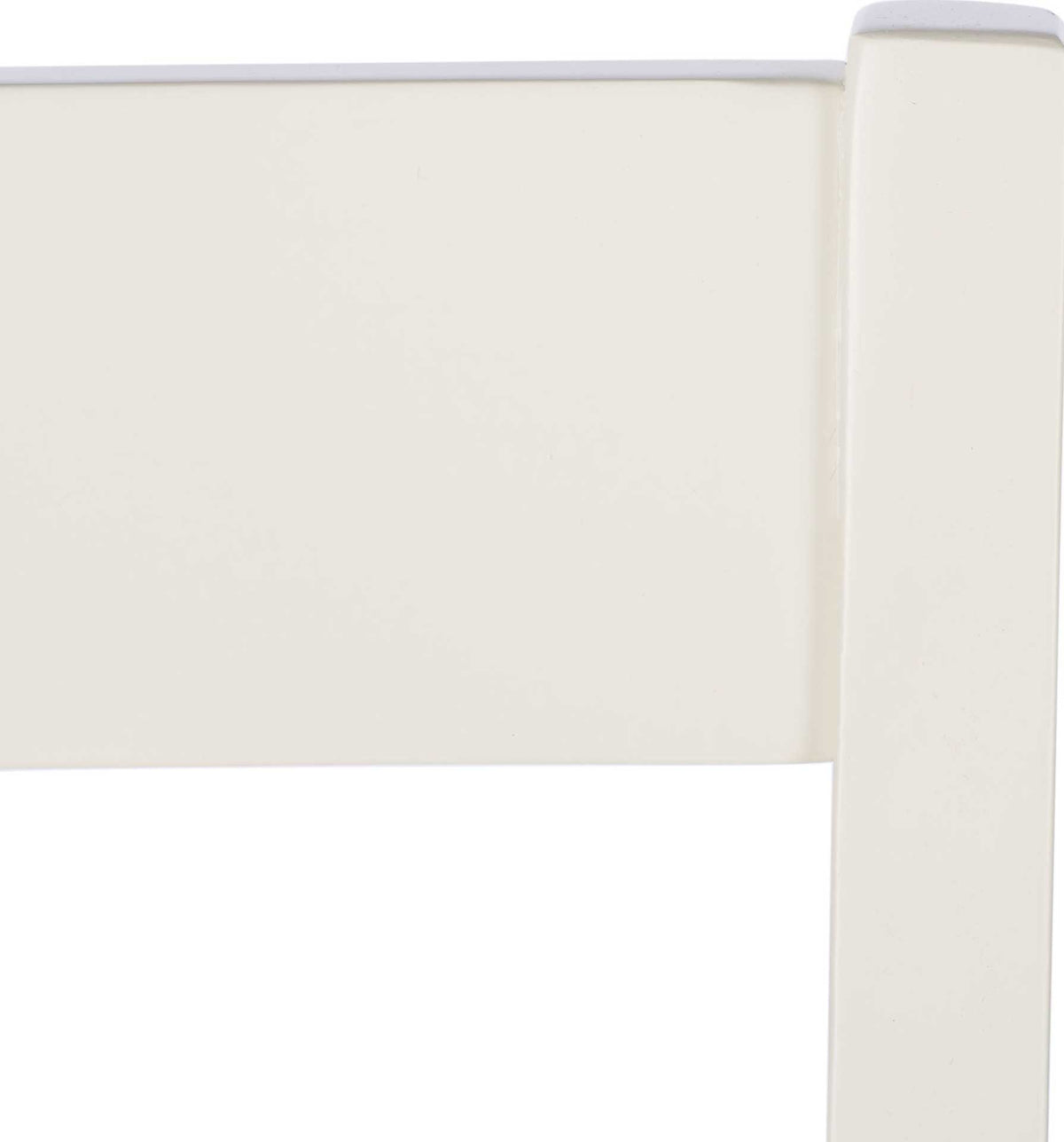 Smooth white-painted wood highlights the clean, classic lines of the ladder back.